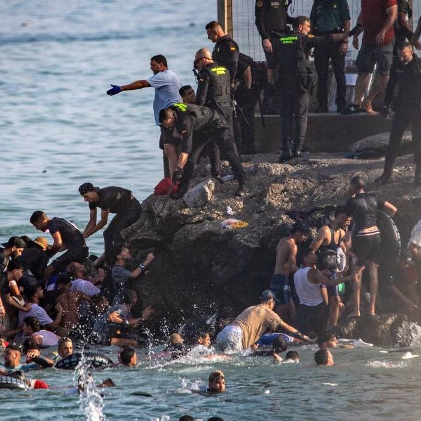 50K migrants make deadly rush into Spain from Morocco episode artwork