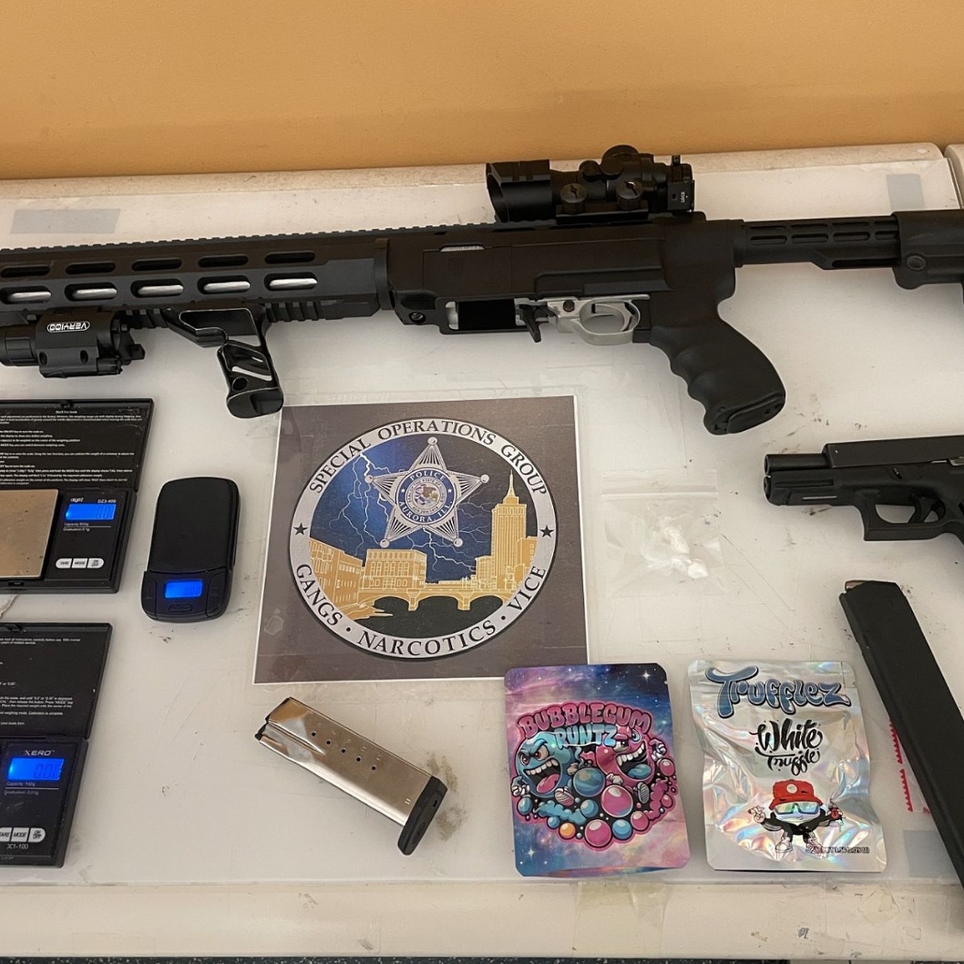Aurora police say they found stolen, loaded handgun and drugs during traffic stop; local man charged episode artwork
