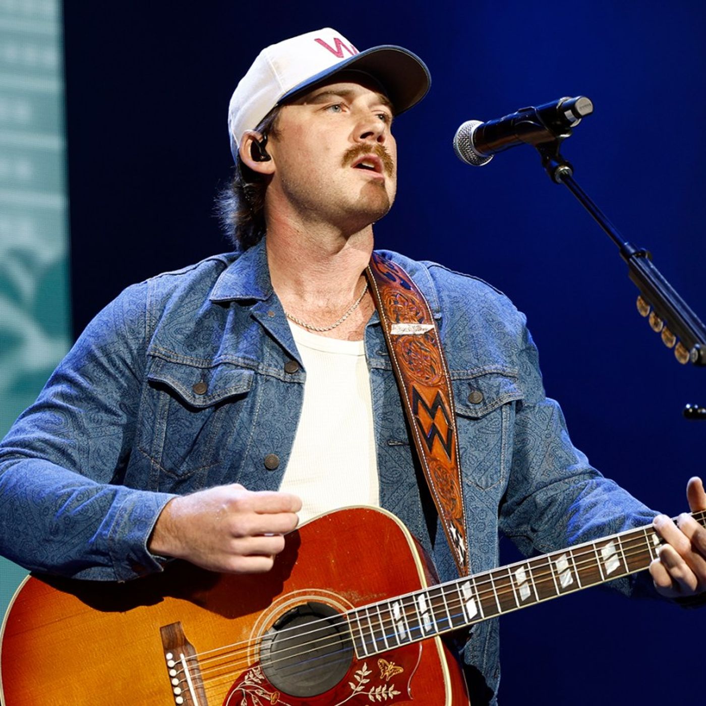 Morgan Wallen Flips Off a Charley Crockett T-Shirt Held by Gavin Adcock