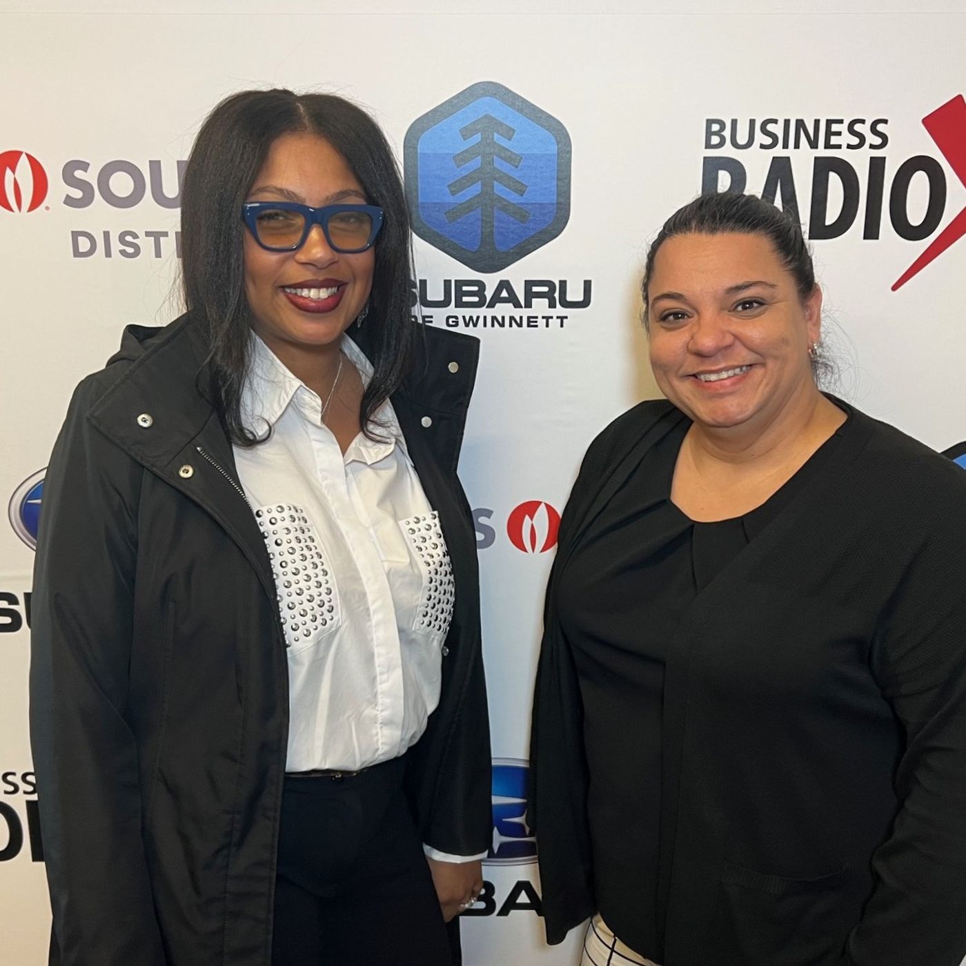 Marie Davis and Shantreal Moore with WoodSpring Suites Buford episode artwork