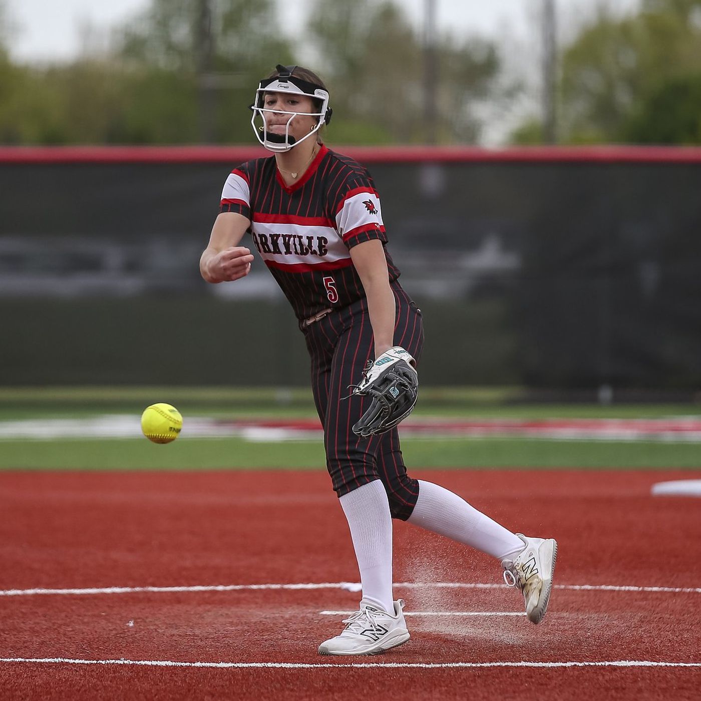 Yorkville’s Bella Rosauer, Oswego’s Jaelynn Anthony clutch in relief as game suspended in the 12th, tied 3-3