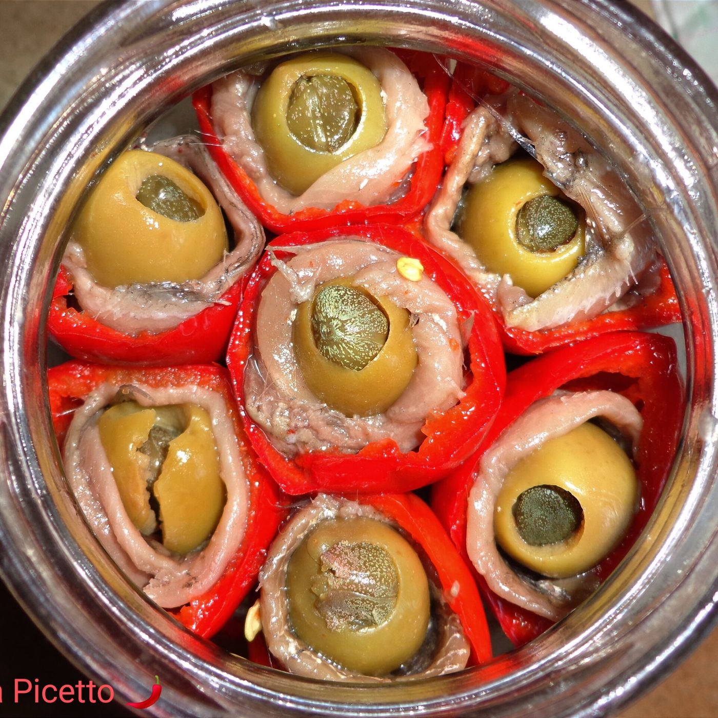 Peperoncini tondi sott'olio ripieni di acciughe olive e capperi episode artwork