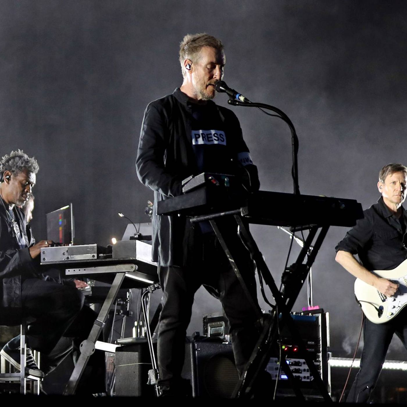 Massive Attack say entire band were detained and some had passports confiscated in Singapore after Palestine flag display