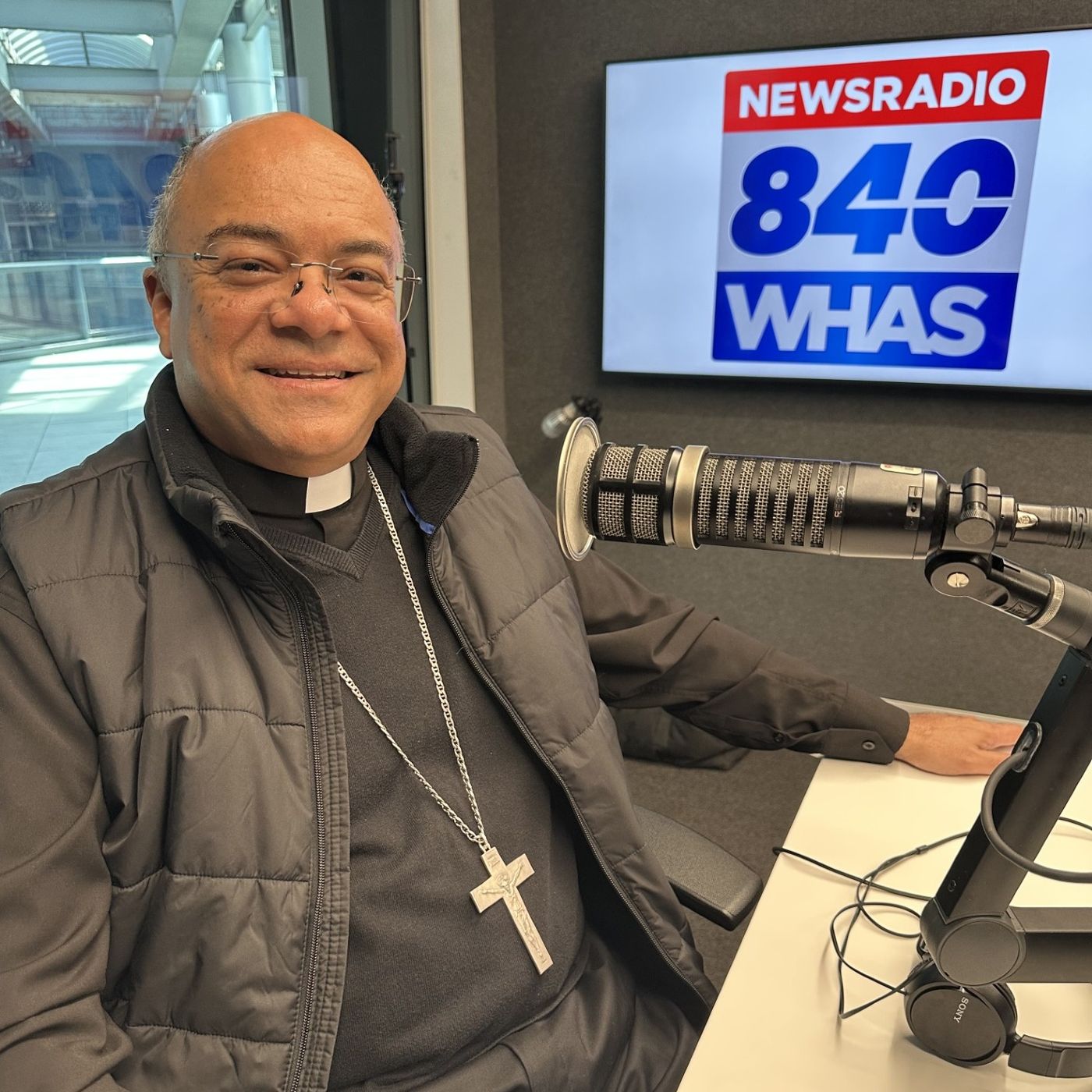 Terry teaches Archbishop Fabre how to succeed at throwing a first pitch