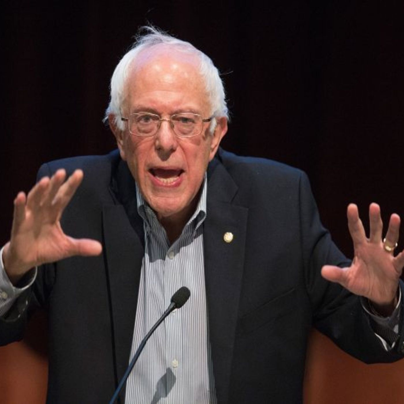 Bernie Sanders stops by, followed by an unknown woman from a neighbourhood welcome committee