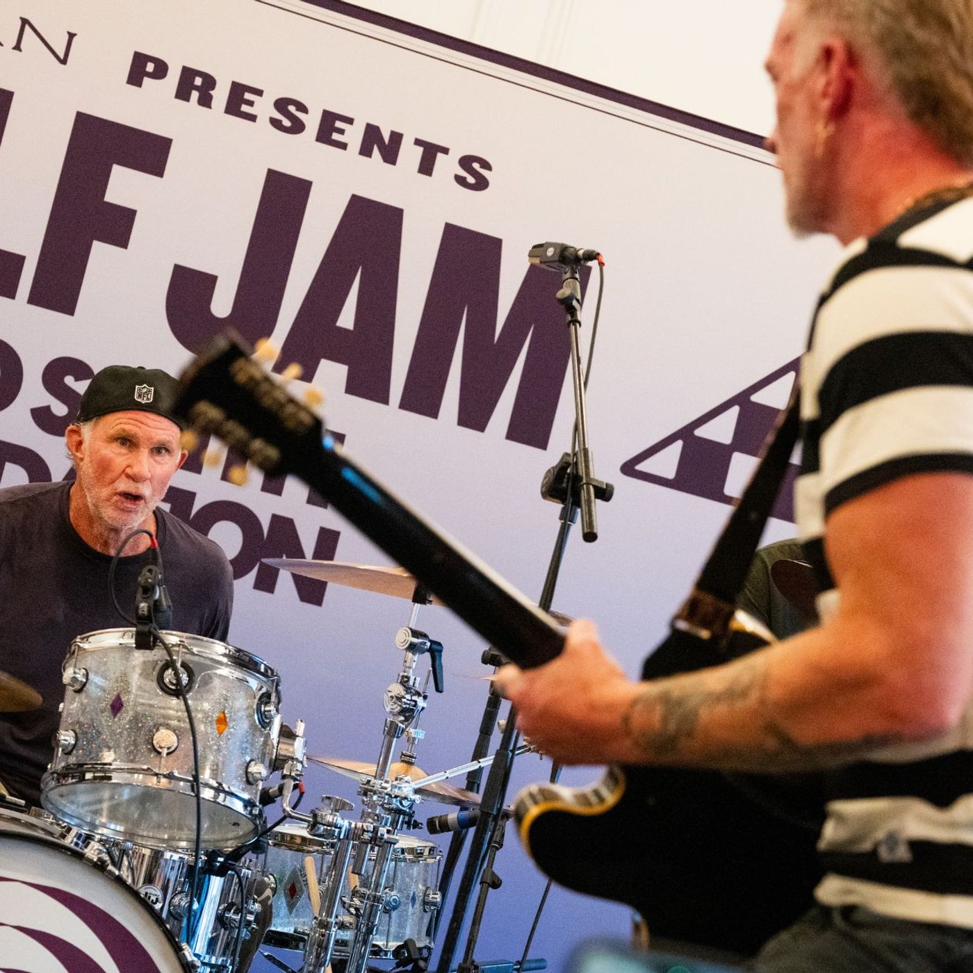 Watch Josh Homme, Chad Smith and Andrew Watt cover David Bowie, INXS, Tom Petty and more at Golf Jam charity event episode artwork
