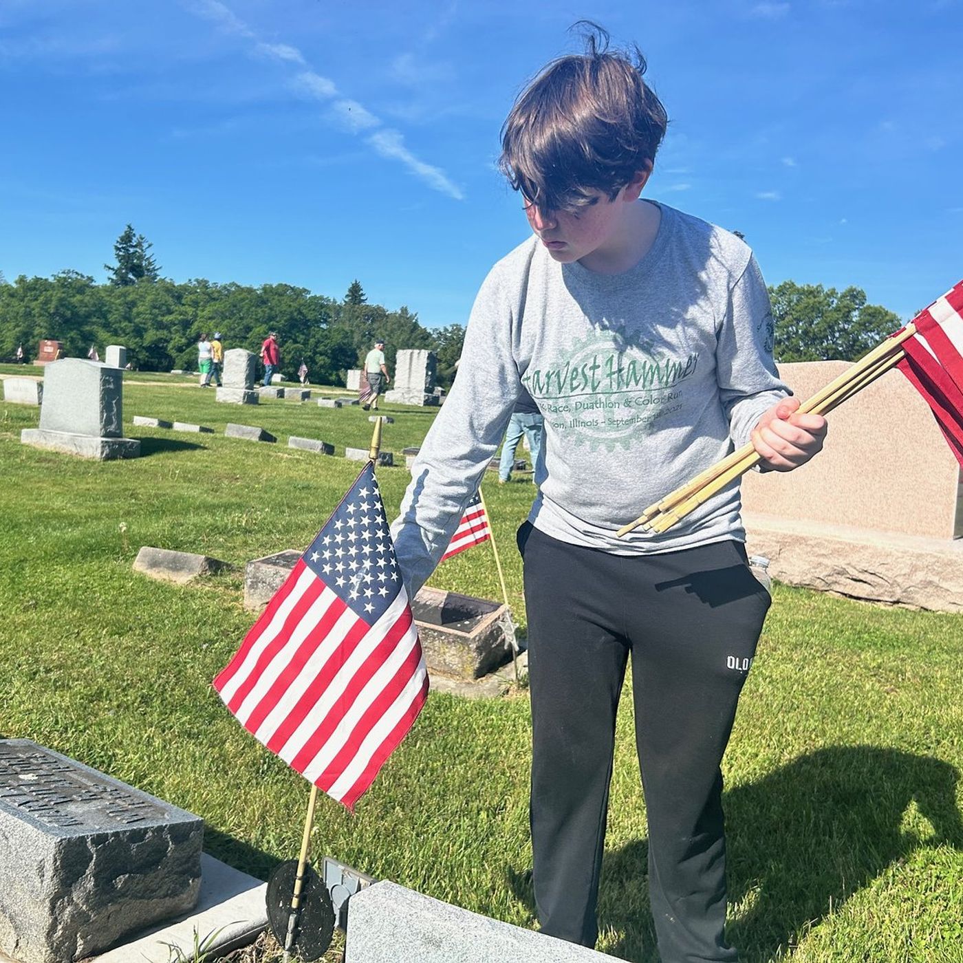 Volunteers place 1,076 American flags in Morrison’s cemetery episode artwork