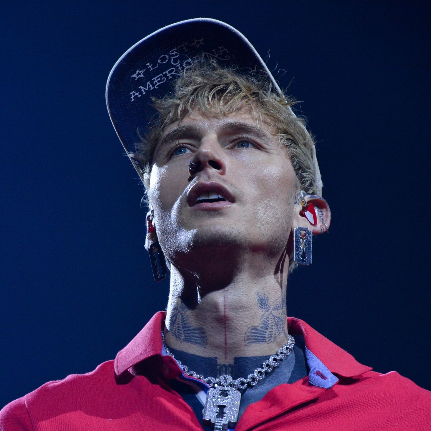 Watch MGK “mess my back up really, really bad” as he somersaults off roof into audience episode artwork