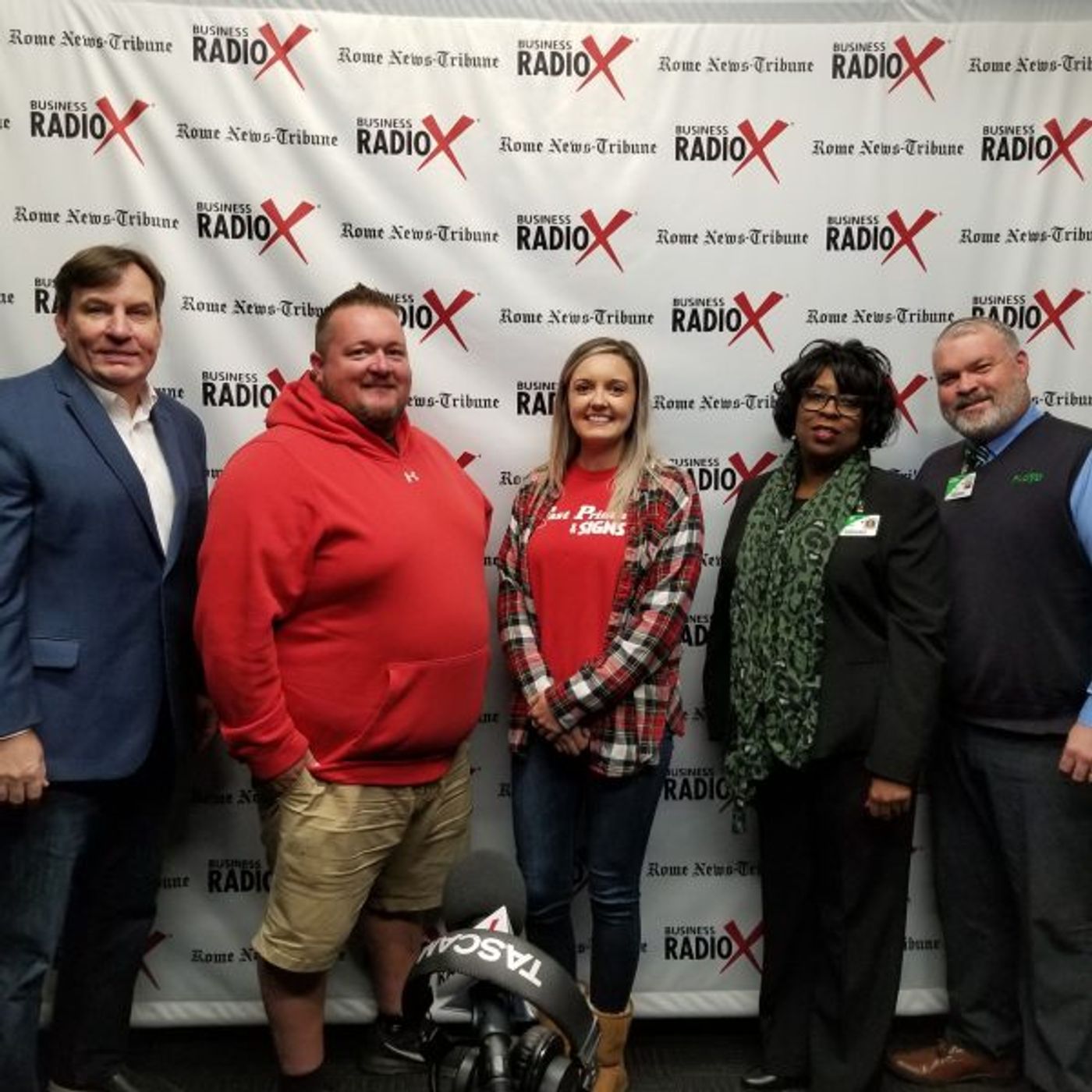 Dan Bevels of Floyd Medical Center, Patsy Wade of Heyman Hospice Care at Floyd, Hannah White of Fast Printing and Signs, and Eric McJunkin o episode artwork