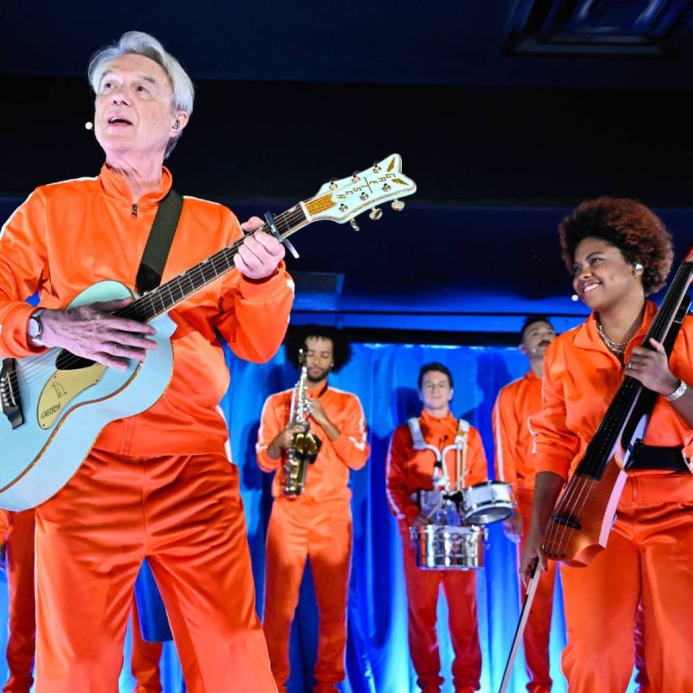 David Byrne Brings a Wave of Orange Tracksuits to Perform 'What Is The Reason for It?' on 'Fallon'