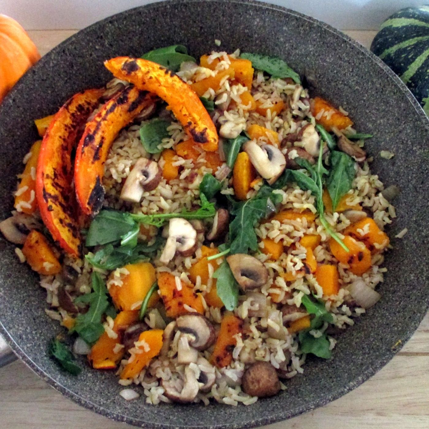 Riso zucca e funghi con rucola