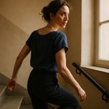 Shoulders Pull Back Before the Sound Lands — The Somatic Compass