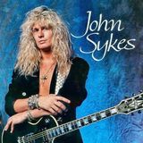 John Sykes. Ricordiamo il chitarrista hard rock britannico che, tra varie band, fu membro degli Whitesnake e coautore di “Is This Love”.