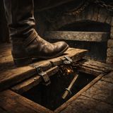 Boot heel pins trapdoor