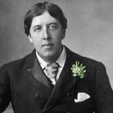 Oscar Wilde wearing a green carnation