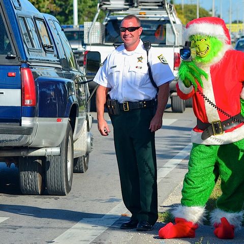 Happy Holidays and the grinch lady cop