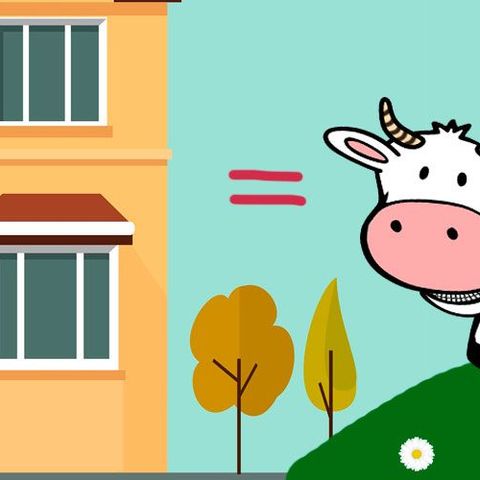 Una vaca y un edificio.