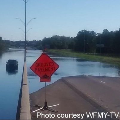 North Carolina Officials Struggle To Block Flooded Roadways