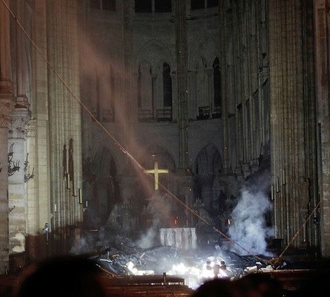 A shining cross amidst the ashes