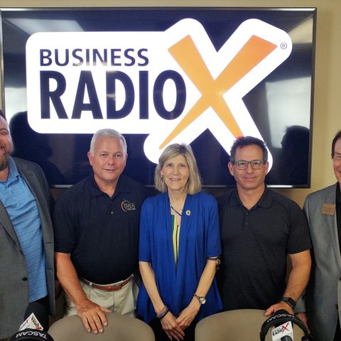 Ron Quinn and Susan Williams with Peach State Bank & Trust and Barry Zeeman with Barry's Menswear & Tuxedo