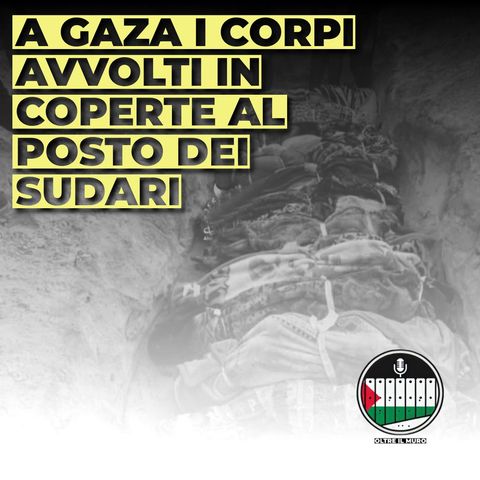 Corpi avvolti in coperte al posto dei sudari mentre si celebra la Giornata dei Diritti Umani