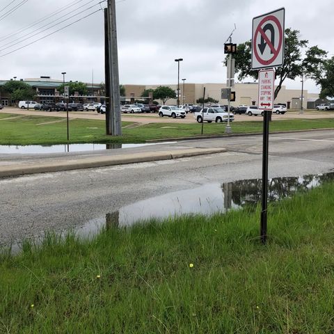 Five of seven College Station city council members approve a U-turn ban on Nueces Drive next to Consolidated High School