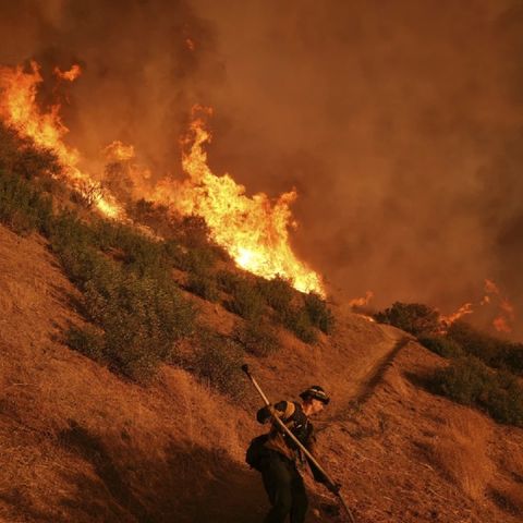 [AP] 24 dead as fire crews try to corral Los Angeles blazes before winds return this week
