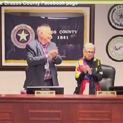 Retiring Brazos County Irma Cauley receives a resolution for her service